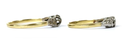 Lot 1094 - Two gold single stone diamond rings