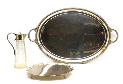 Lot 32 - A silver plated twin handled oval serving tray