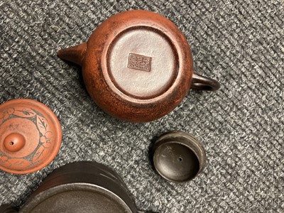 Lot 176 - A collection of seven Chinese Yixing zisha, teapots