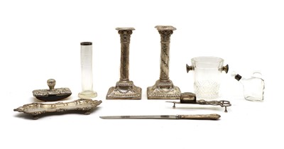 Lot 31 - A pair of silver Corinthian column candlesticks