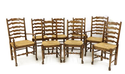 Lot 423 - A set of eight ash ladder back chairs