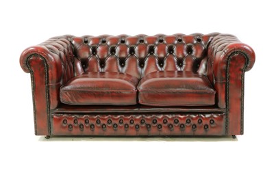 Lot 544 - A leather two seater Chesterfield sofa