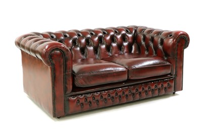 Lot 544 - A leather two seater Chesterfield sofa