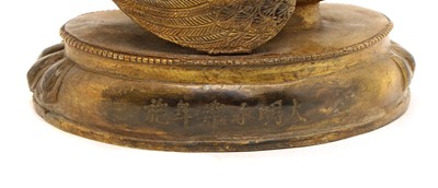 Lot 74 - A Sino-Tibetan bronze buddha