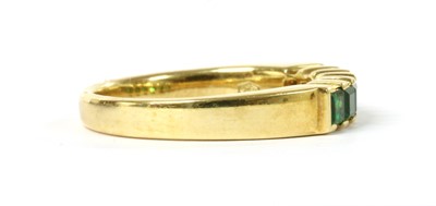 Lot 1198 - A gold six stone tsavorite garnet ring