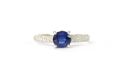 Lot 1213 - An 18ct white gold sapphire and diamond ring