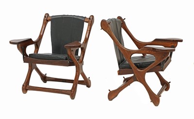 Lot 500 - A pair of cocobolo wood and leather armchairs