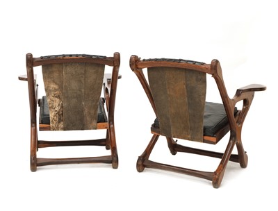 Lot 500 - A pair of cocobolo wood and leather armchairs