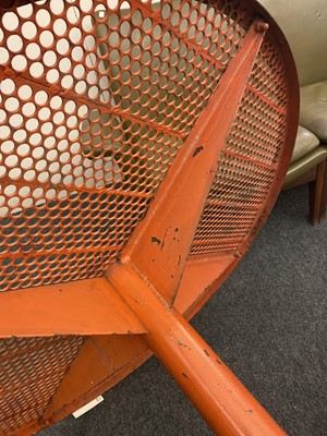 Lot 671 - A red painted and perforated metal garden table