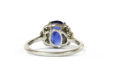 Lot 1068 - A sapphire and diamond ring