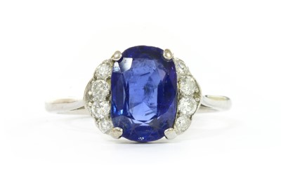 Lot 1068 - A sapphire and diamond ring