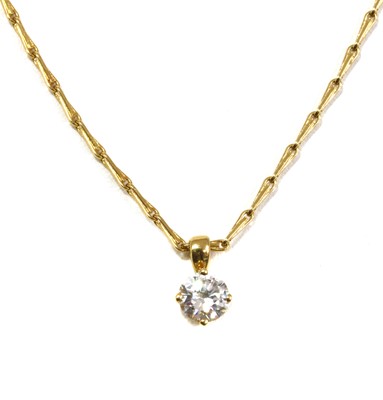 Lot 402 - A gold single stone diamond pendant