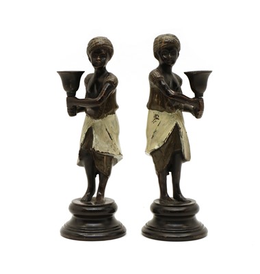 Lot 111A - A pair of bronze gold painted candlesticks in the manner of Franz Bergman