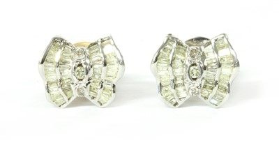 Lot 1132 - A pair of white gold diamond earrings
