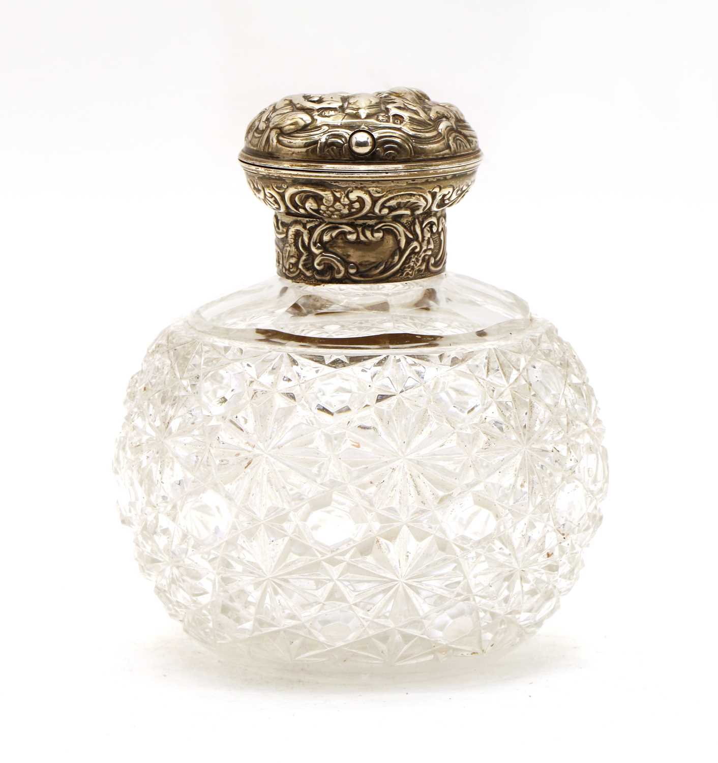 Lot 26 - A William Commyns silver topped cut glass perfume bottle