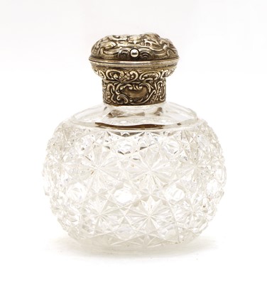 Lot 26 - A William Commyns silver topped cut glass perfume bottle