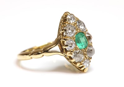 Lot 94 - A late Victorian emerald and diamond marquise shaped cluster ring, by Alabaster & Wilson, c.1900