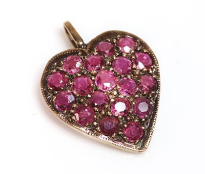 Lot 350 - A 9ct rose gold ruby set heart pendant, c.1970