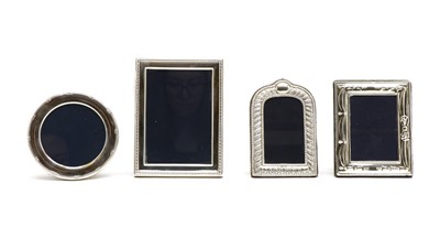 Lot 7 - A set of four silver-mounted photo frames