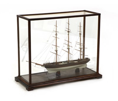 Lot 323 - A wooden ship model in glass case