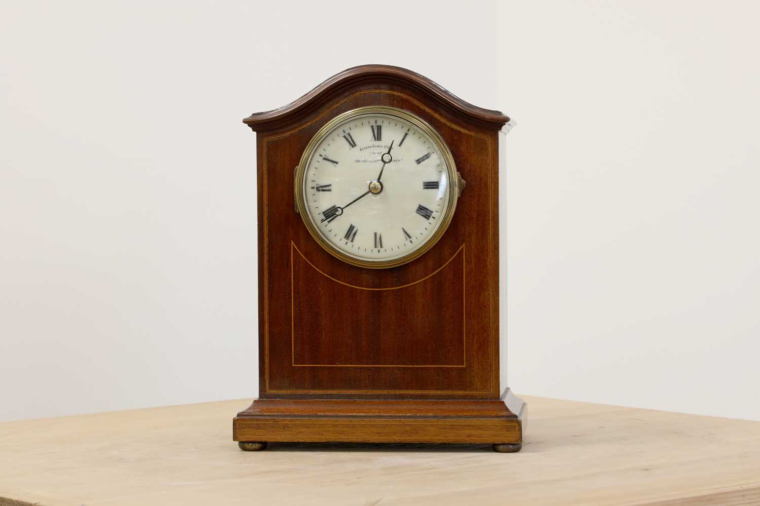 Lot 613 An Edwardian Eureka electric mantel clock,