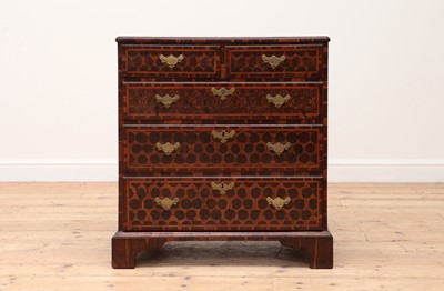 Lot 200 - An oyster-veneered cocuswood chest of drawers