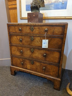 Lot 121 - A small George I-style walnut chest of drawers