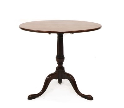 Lot 219 - A George III tripod mahogany table