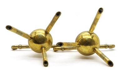 Lot 154 - A pair of brass firedogs designed by Christopher Dresser