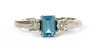 Lot 283 - A white gold blue topaz and diamond three stone ring