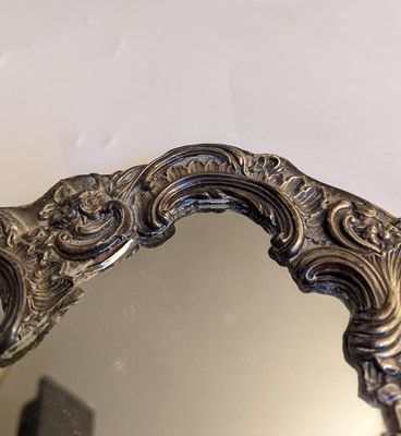 Lot 28 - A Victorian silver dressing table mirror by William Comyns