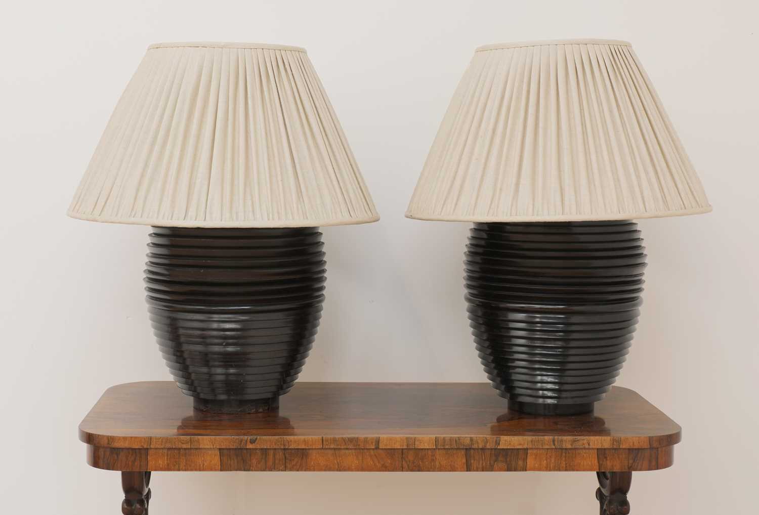 Lot 131 - A pair of large turned table lamps