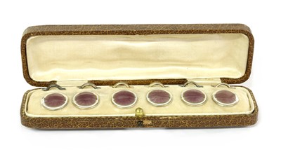 Lot 65 - A cased set of six silver gilt enamel buttons