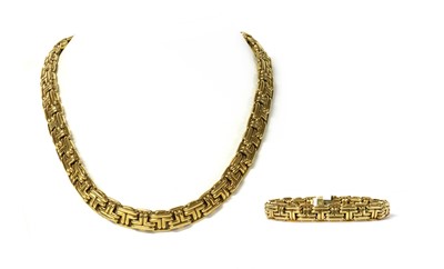 Lot 1074 - An 18ct gold necklace and bracelet suite, by Garrard