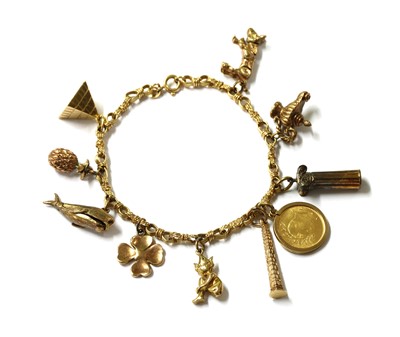 Lot 352 - A gold charm bracelet