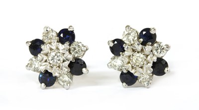 Lot 277 - A pair of 18ct gold diamond and sapphire cluster earrings