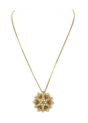 Lot 44 - A late Victorian gold diamond and split pearl starburst brooch/pendant, c.1900