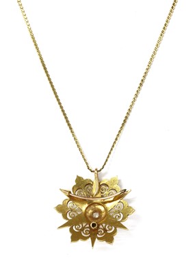 Lot 44 - A late Victorian gold diamond and split pearl starburst brooch/pendant, c.1900