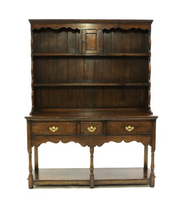 Lot 480 - A George III style oak dresser