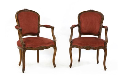 Lot 524 - A pair of early 20th century Louis XVI style walnut fauteuils