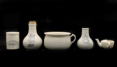 Lot 272 - A collection of chemist's pottery items
