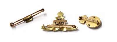 Lot 69 - Three gold and enamel regimental military sweetheart brooches