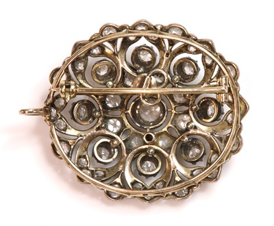 Lot 6 - A Victorian diamond set oval cluster brooch/pendant, c.1880