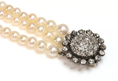 Lot 151 - A three row pearl bracelet