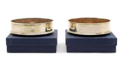 Lot 2 - A pair of modern silver wine coasters