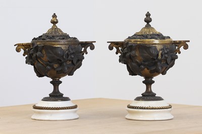 Lot 160 - A pair of French bronze and ormolu jars and covers