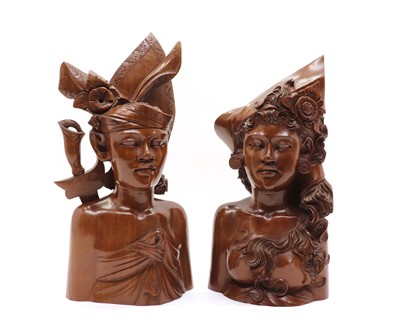 Lot 210 - A pair of Balinese carved hardwood busts
