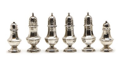 Lot 21 - A set of four silver pepperettes