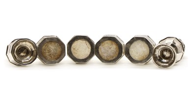 Lot 21 - A set of four silver pepperettes