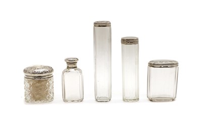 Lot 18 - Five silver lidded cut glass dressing table jars